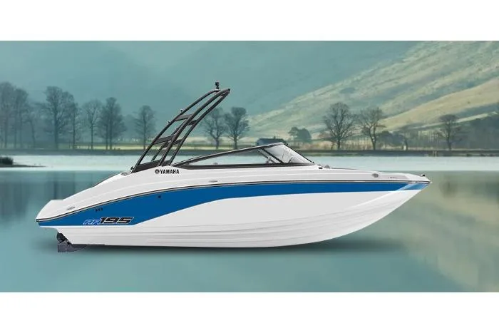 The Image of 2026 Yamaha Boats AR195 on serene lake with scenic mountain backdrop. - 0