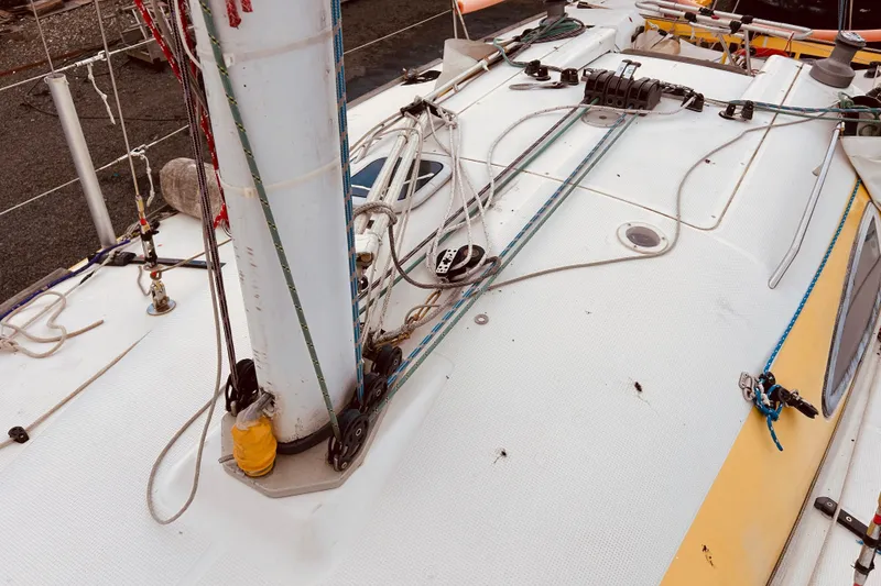 Slide: The Image of Deck of 2003 Beneteau Figaro 2 sailboat with rigging and mast details. - 9