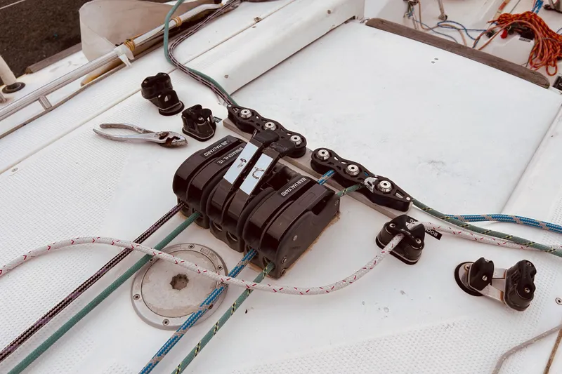 Slide: The Image of Deck of 2003 Beneteau Figaro 2 with winches and ropes. - 10