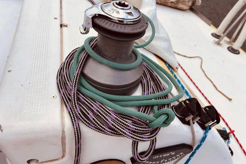Slide: The Image of Winch and ropes on 2003 Beneteau Figaro Beneteau 2 sailboat deck. - 12