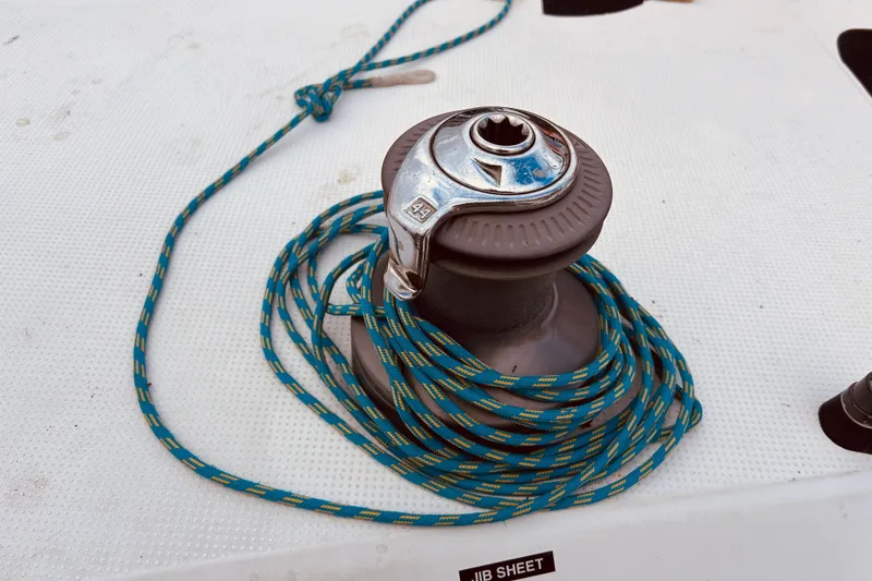 Slide: The Image of Winch with blue rope on 2003 Beneteau Figaro Beneteau 2 sailboat deck. - 13