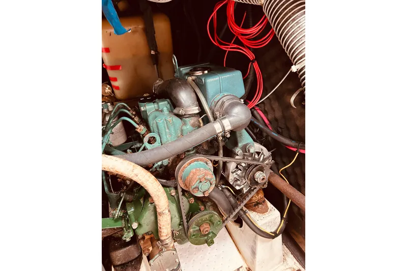 Slide: The Image of Engine compartment of 2003 Beneteau Figaro Beneteau 2 sailboat, showing detailed mechanical components. - 15