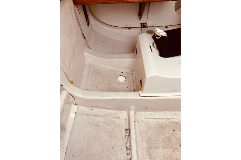 Slide: The Image of 2003 Beneteau Figaro Beneteau 2 interior cockpit, showcasing seating and storage areas. - 17