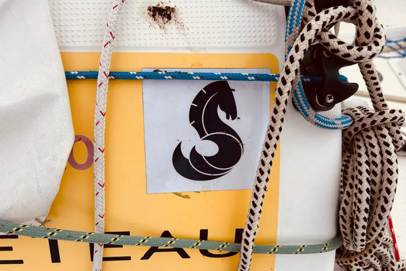 Slide: The Image of Close-up of ropes and logo on a 2003 Beneteau Figaro Beneteau 2 sailboat. - 28