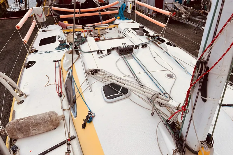 Slide: The Image of 2003 Beneteau Figaro 2 sailboat deck with rigging and equipment. - 7