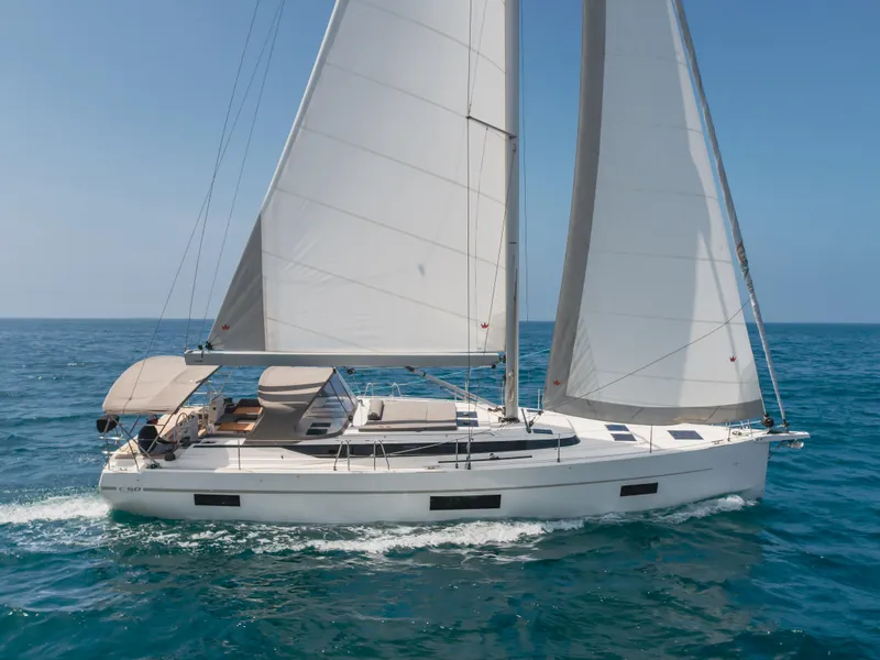 The Image of 2021 Bavaria C50 Style sailing yacht cruising on open sea. - 0