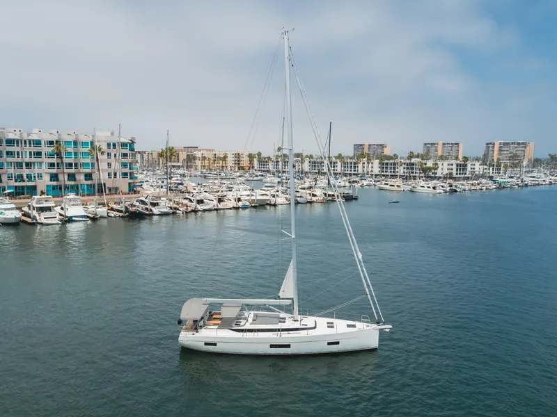 Slide: The Image of Sailing yacht Bavaria C50 Style 2021 in marina with modern buildings in background. - 16