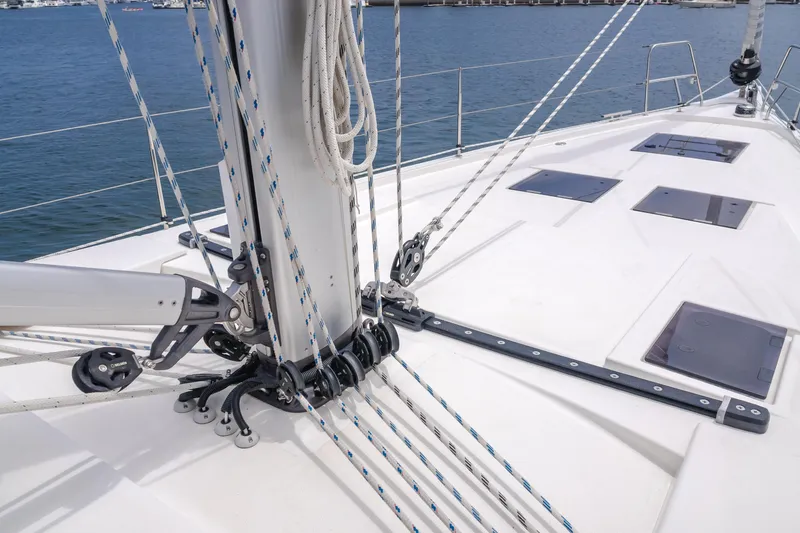 Slide: The Image of 2021 Bavaria C50 Style yacht deck with rigging and hatches, docked at marina. - 23