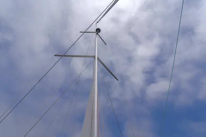 Slide: The Image of Sailboat mast of 2021 Bavaria C50 Style against cloudy sky. - 24