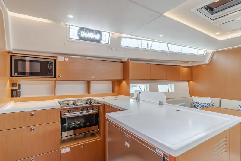 Slide: The Image of Modern kitchen interior of 2021 Bavaria C50 Style yacht with sleek wood cabinetry. - 35