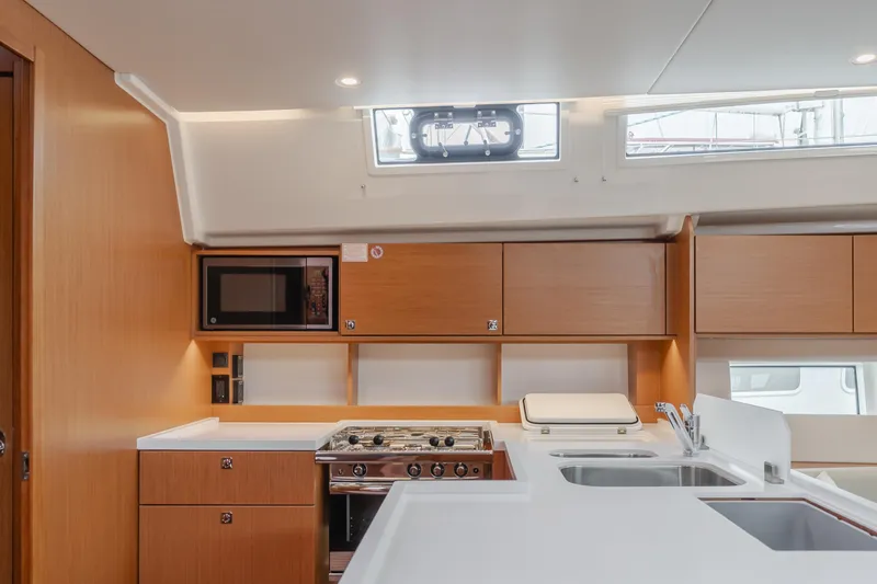 Slide: The Image of Modern kitchen interior of 2021 Bavaria C50 Style yacht with wood cabinetry and appliances. - 37