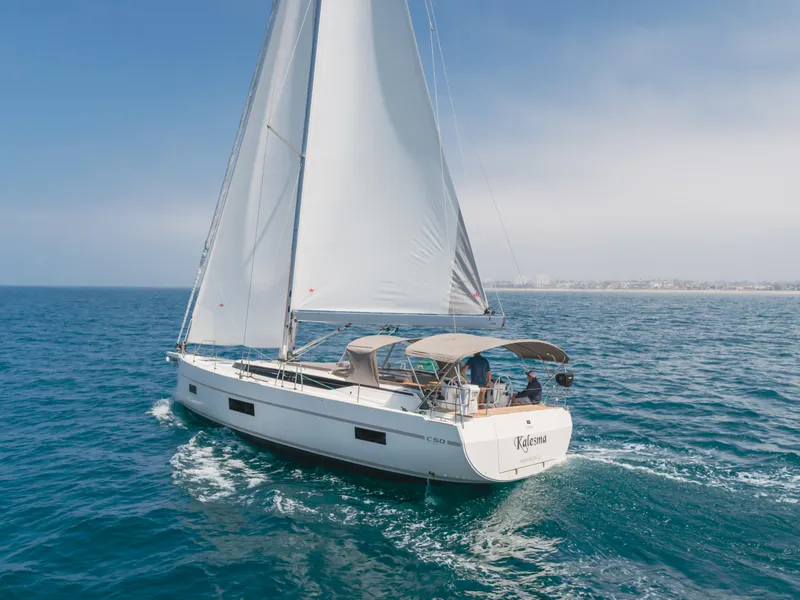 Slide: The Image of 2021 Bavaria C50 Style sailing on open sea under clear skies. - 4