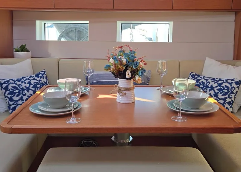 Slide: The Image of Elegant dining setup in 2021 Bavaria C50 Style yacht interior with floral centerpiece. - 41