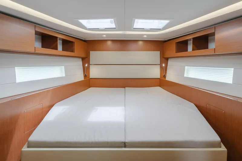 Slide: The Image of Luxurious interior of 2021 Bavaria C50 Style yacht with spacious bed and wooden cabinetry. - 44