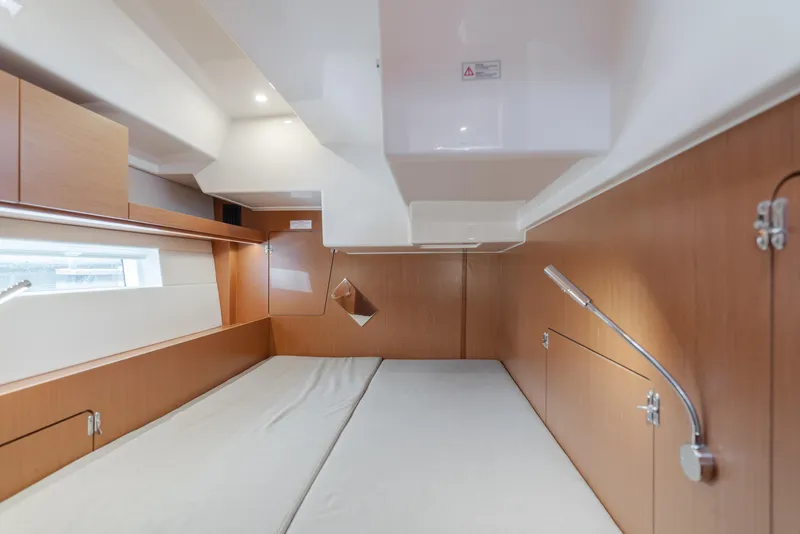 Slide: The Image of Interior cabin of 2021 Bavaria C50 Style yacht, featuring modern wood paneling and sleek design. - 50