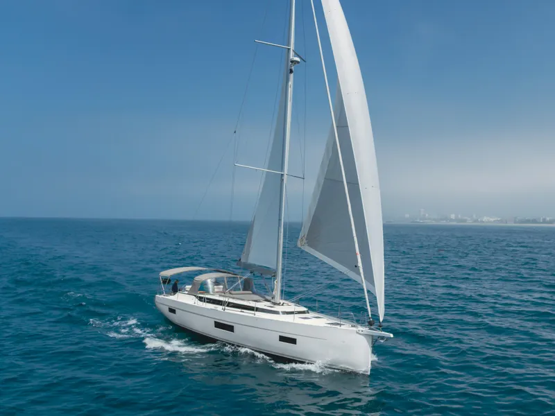 Slide: The Image of 2021 Bavaria C50 Style yacht sailing on open sea under clear blue sky. - 8