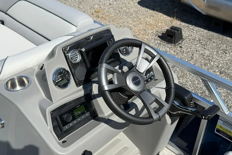Slide: The Image of 2026 Tahoe Pontoon Sport 85 Rear Fish steering console with modern controls and sleek design. - 3