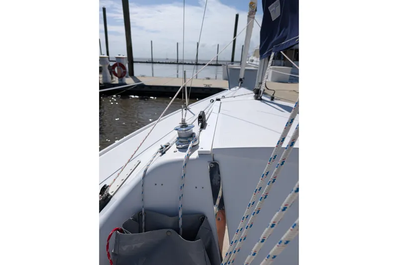 Slide: The Image of 2013 Catalina 22 Capri sailboat deck with ropes and winch at marina. - 1