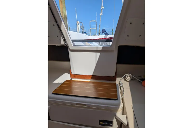 Slide: The Image of Interior view of a 2013 Catalina 22 Capri sailboat with a hatch and seating area. - 10