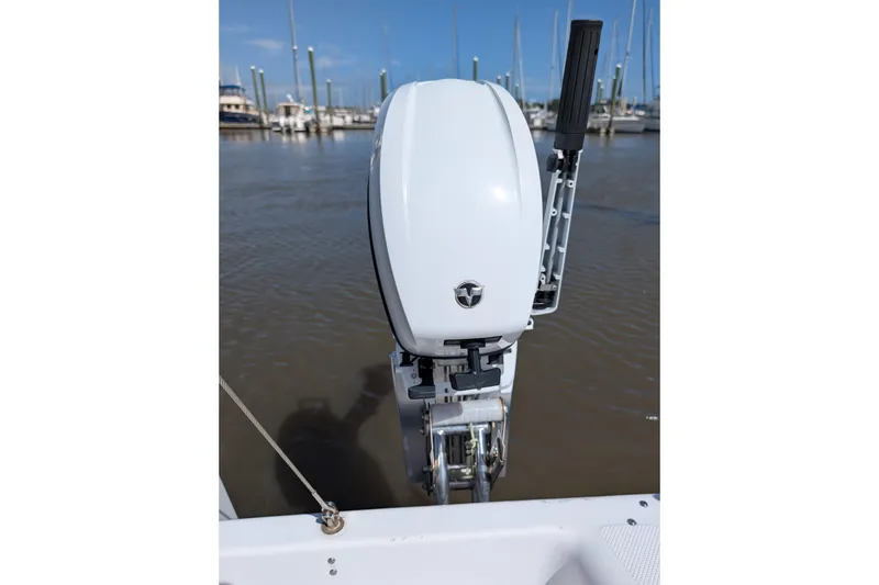 Slide: The Image of Outboard motor on 2013 Catalina 22 Capri sailboat, docked in marina. - 5