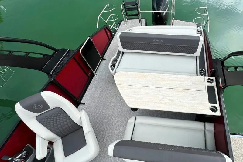 Slide: The Image of 2026 Harris Sunliner 250 SLE pontoon boat interior with modern seating and sleek design. - 11