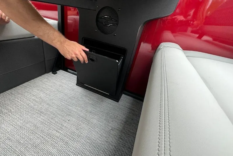 Slide: The Image of Interior of 2026 Harris Sunliner 250 SLE with storage compartment and speaker. - 17