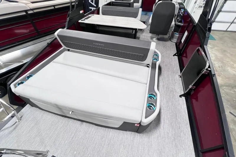 Slide: The Image of 2026 Harris Sunliner 250 SLE pontoon boat interior with plush seating and modern design. - 23