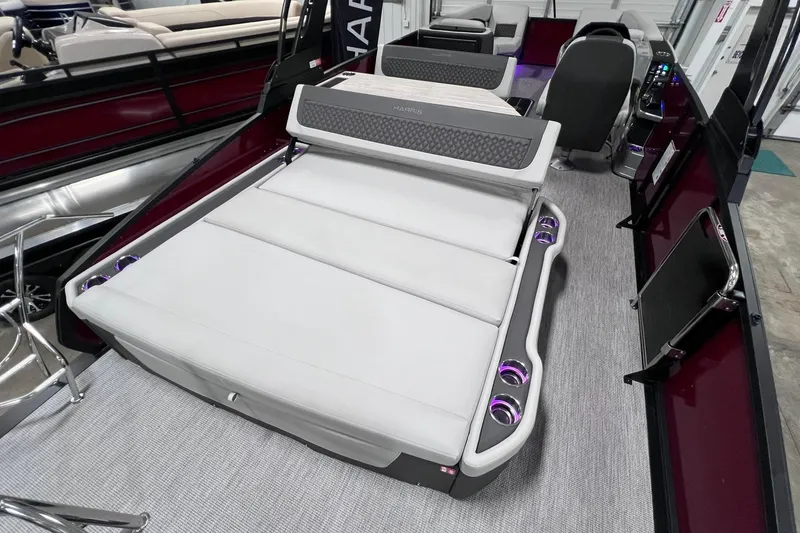 Slide: The Image of 2026 Harris Sunliner 250 SLE pontoon boat interior with luxurious seating and modern design. - 24