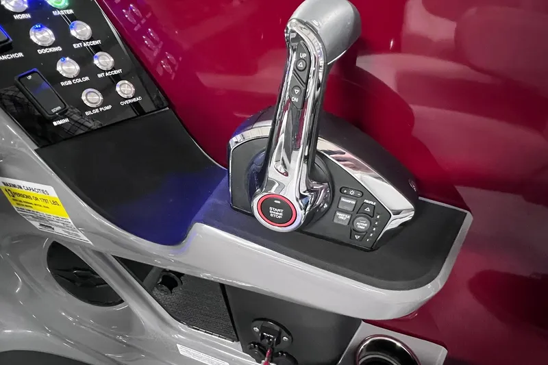 Slide: The Image of Control panel of 2026 Harris Sunliner 250 SLE boat with throttle and buttons. - 30