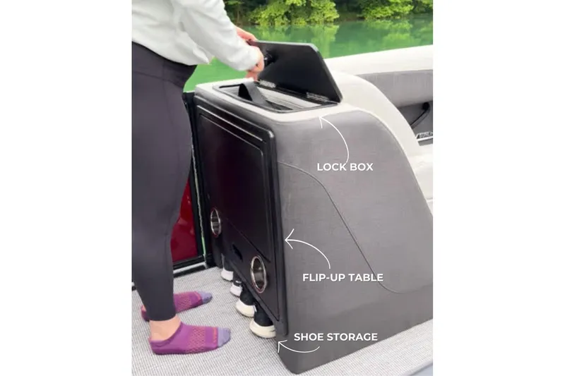 Slide: The Image of 2026 Harris Sunliner 250 SLE boat features lock box, flip-up table, and shoe storage. - 46