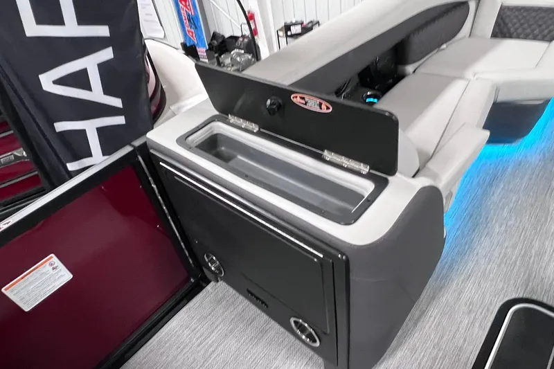 Slide: The Image of 2026 Harris Sunliner 250 SLE interior with seating and storage compartment. - 47