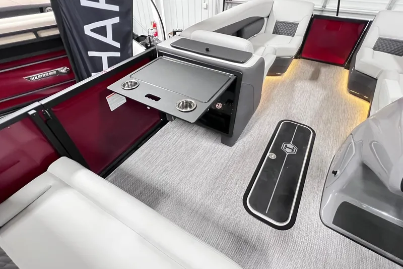 Slide: The Image of 2026 Harris Sunliner 250 SLE interior with seating, table, and ambient lighting. - 49