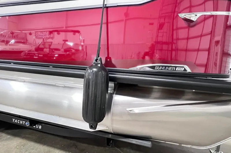 Slide: The Image of 2026 Harris Sunliner 250 SLE pontoon boat with red exterior and black fender. - 52