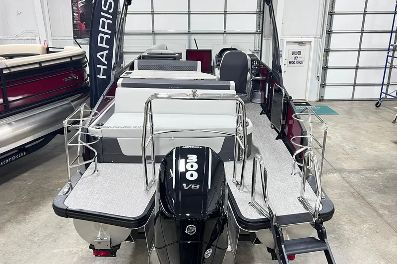 Slide: The Image of 2026 Harris Sunliner 250 SLE pontoon boat with powerful 300 V8 engine in showroom. - 59