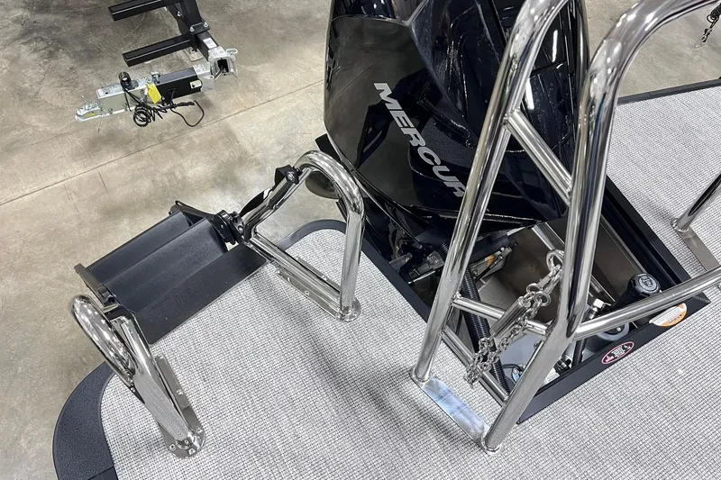 Slide: The Image of 2026 Harris Sunliner 250 SLE boat with Mercury engine and stainless steel ladder. - 62