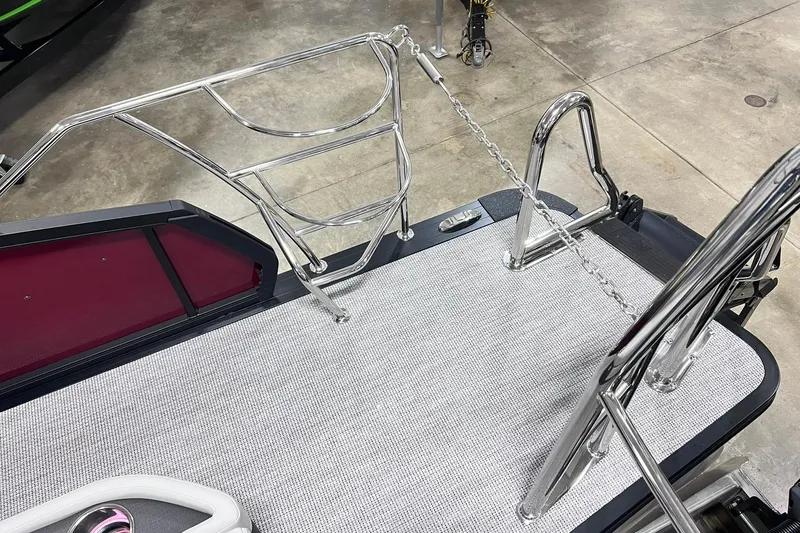 Slide: The Image of 2026 Harris Sunliner 250 SLE boat deck with stainless steel railings and chain. - 68