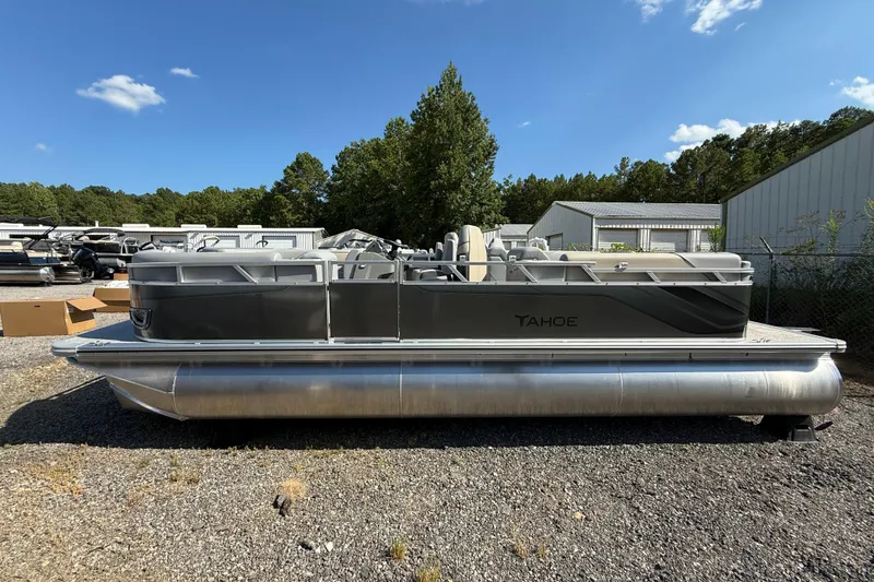 Slide: The Image of 2026 Tahoe Pontoon Sport 85 Quad Lounger, sleek design, parked outdoors. - 4