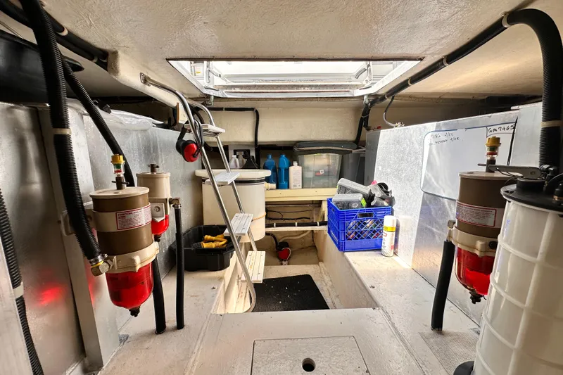 Slide: The Image of Engine room of 1998 Navigator 4800 yacht with storage and equipment. - 10