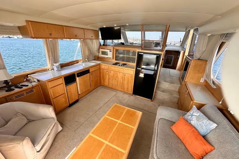 Slide: The Image of Luxurious interior of 1998 Navigator 4800 yacht with modern kitchen and cozy seating. - 18