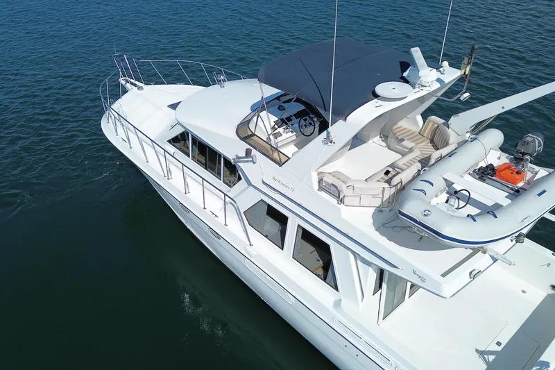 Slide: The Image of Aerial view of 1998 Navigator 4800 yacht on calm water. - 6