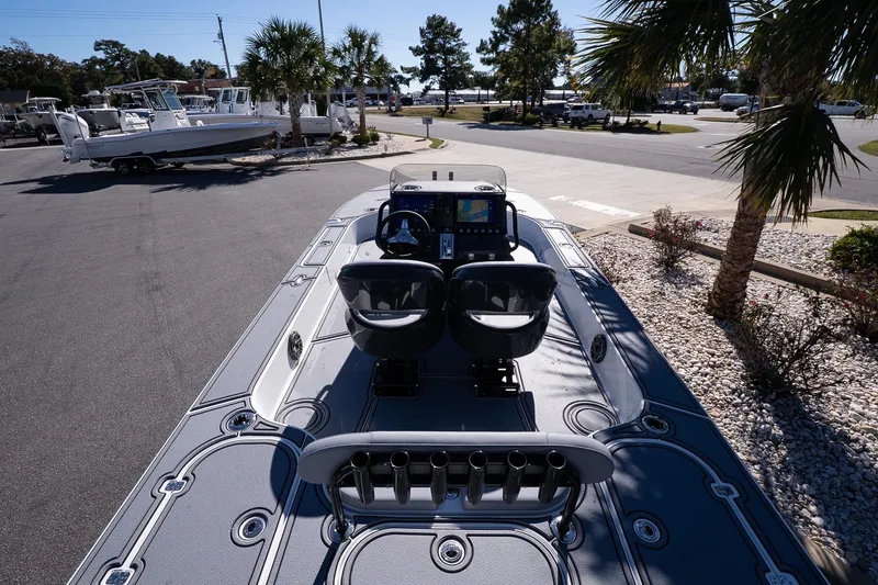 Slide: The Image of 2026 Turner Boatworks 24 SAVAGE, sleek design, dual seats, modern dashboard, outdoor display. - 20