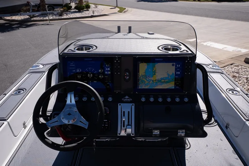 Slide: The Image of 2026 Turner Boatworks 24 SAVAGE dashboard with advanced navigation and control systems. - 24