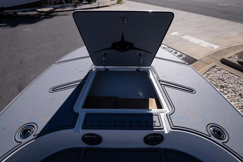 Slide: The Image of Open storage compartment on 2026 Turner Boatworks 24 SAVAGE deck. - 28
