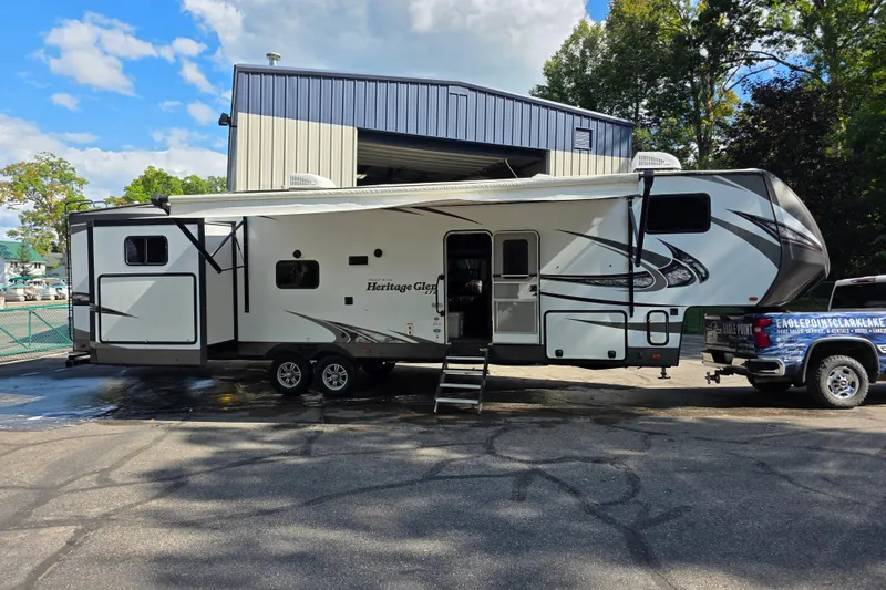 Slide: The Image of 2018 Heritage Glen 356QB RV parked outdoors near a building. - 11