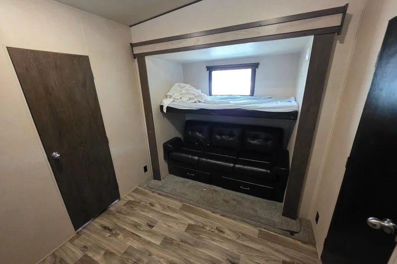 Slide: The Image of 2018 Heritage Glen 356QB interior with bunk bed, sofa, and wood flooring. - 23