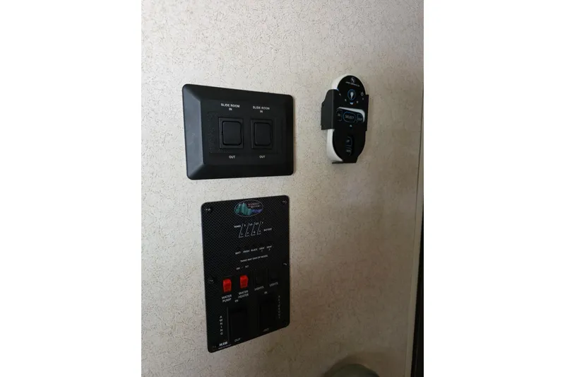 Slide: The Image of 2018 Heritage Glen 356QB control panel with slide room and system switches. - 30