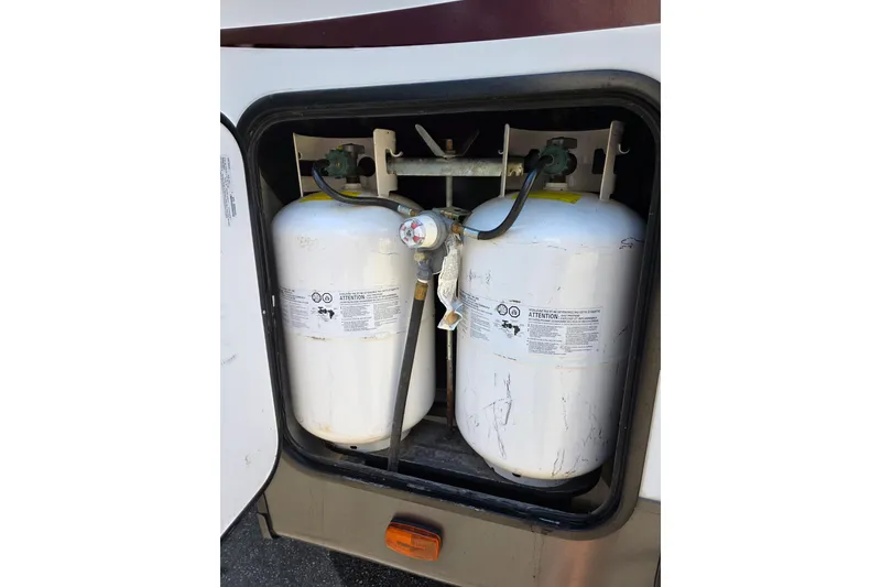 Slide: The Image of 2018 Heritage Glen 356QB RV propane tanks in storage compartment. - 35