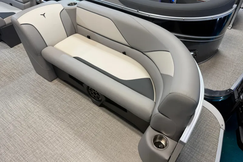 Slide: The Image of 2026 Tahoe Pontoon Sport 85 Rear Fish boat seating with cup holder, gray and beige upholstery. - 3
