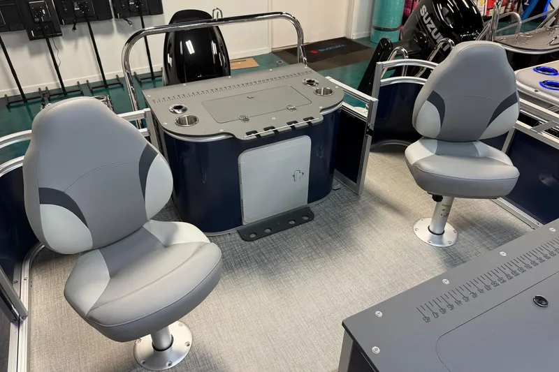 Slide: The Image of 2026 Tahoe Pontoon Sport 85 Rear Fish interior with two swivel seats and fishing station. - 7