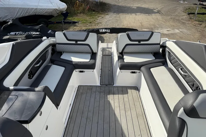 Slide: The Image of 2021 Yamaha Boats 275 E interior with sleek seating and modern design. - 11